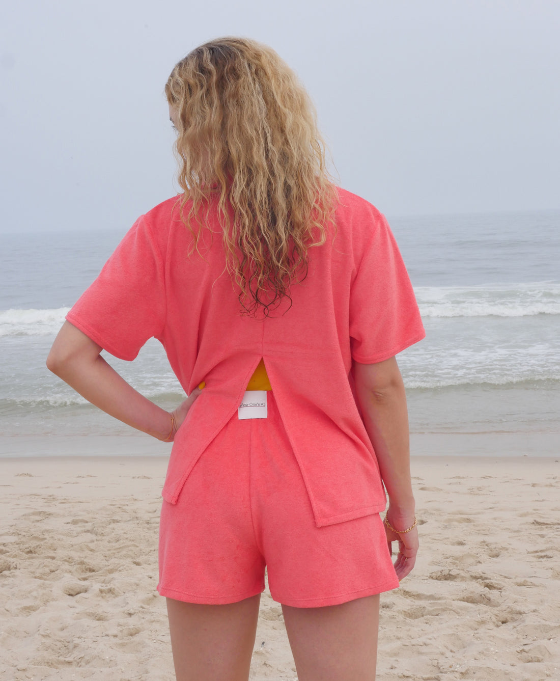 Wear One's At Aqualina Terry Cloth Shorts in Aperol Pink on Model Full Back View