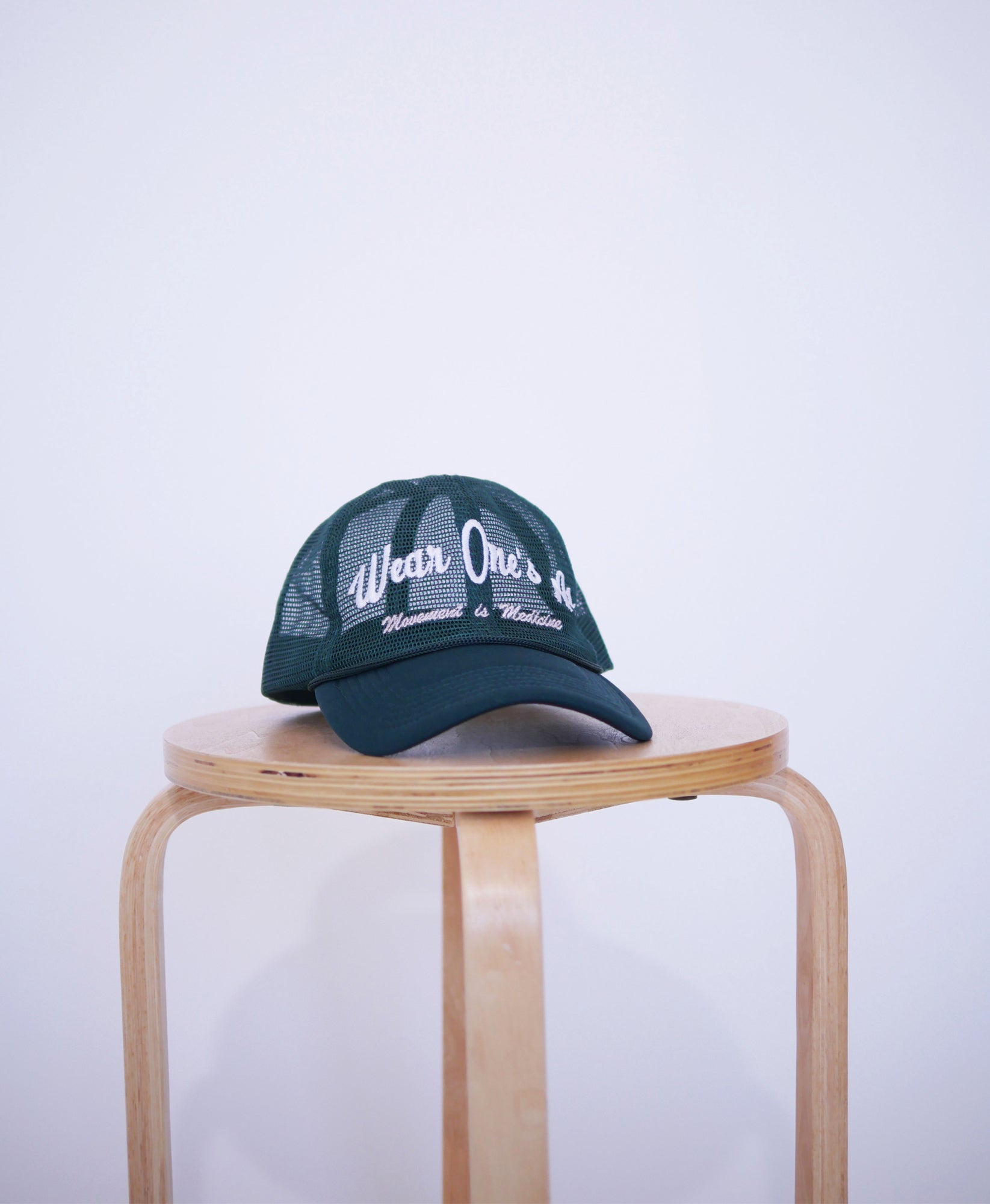 Wear One's At Logo Trucker Hat in Pine Front Closeup View