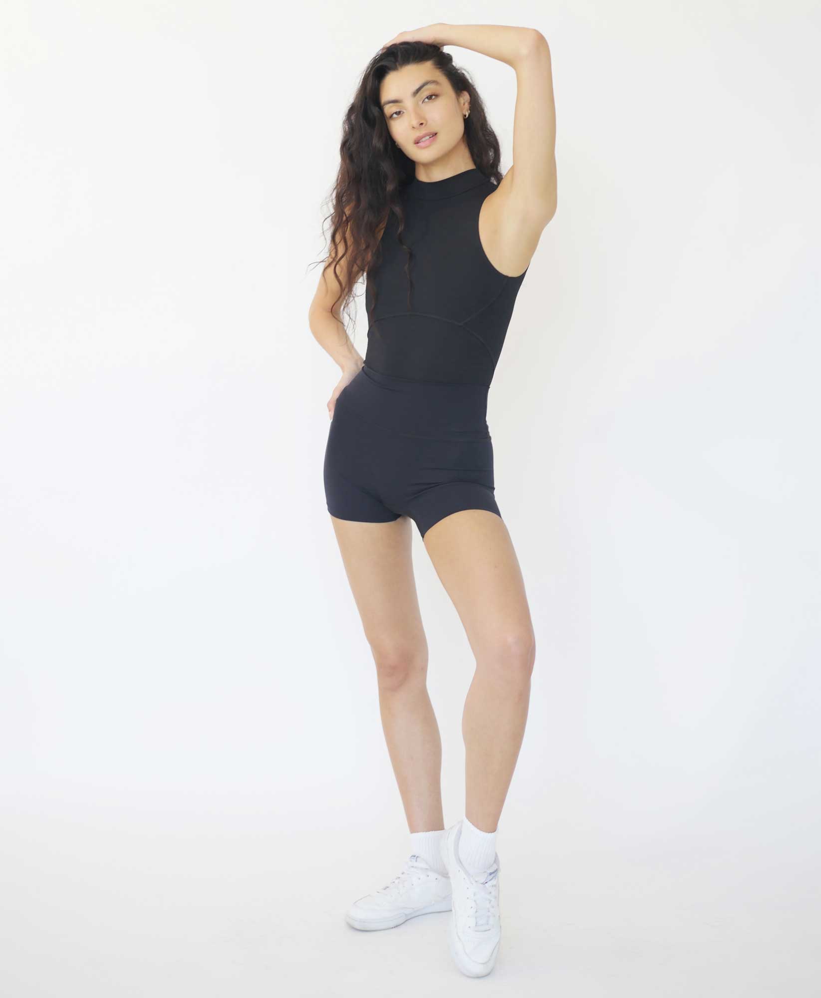 Wear One's At Aerobic Rib Bodysuit in Jet Black on Model with Arm Up Full Front View