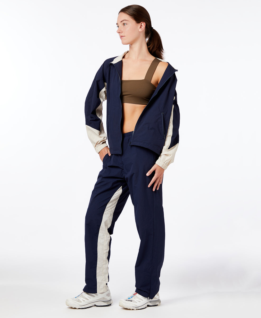 Wear One's At Alpine Pant in Navy Dune on model with jacket unzipped front view