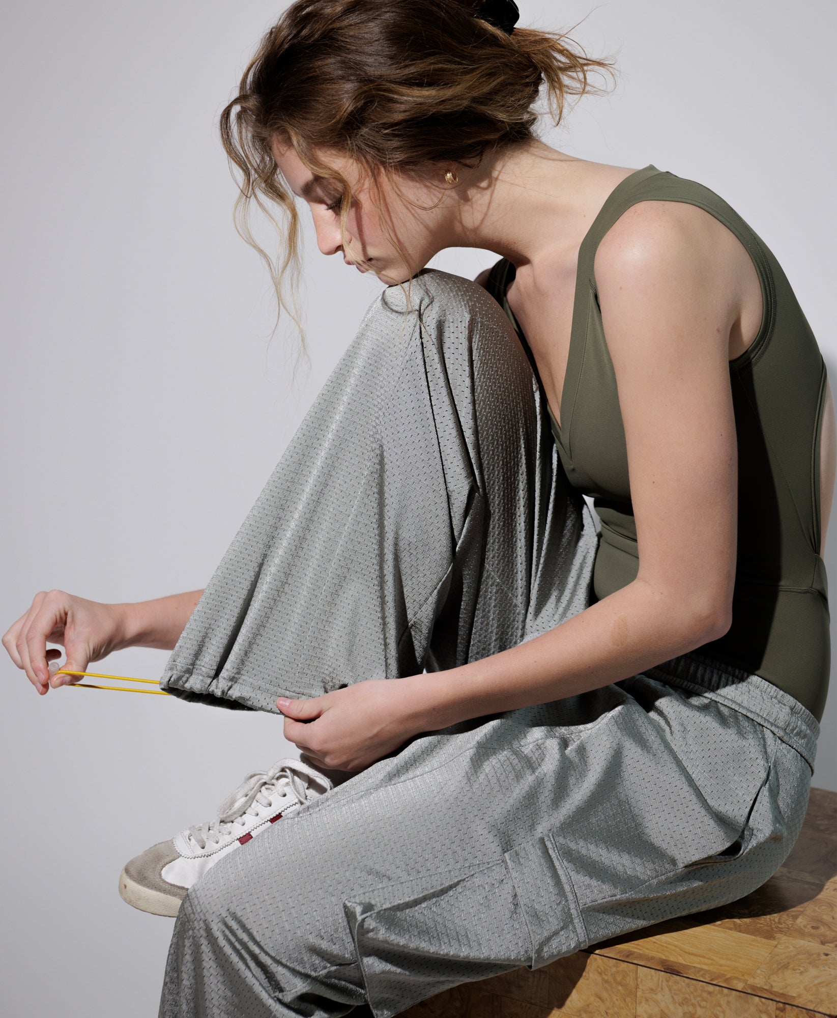 Wear One's At Arena Pant in mineral on model tightening pant bottoms