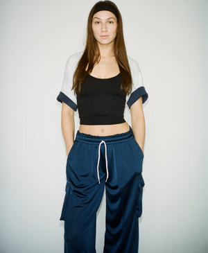 Wear One's At Arena Pant in navy on model with hands in pockets front view