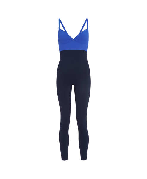 Wear One's At The Contour Unitard in Royal Blue and Navy on model stretching front view