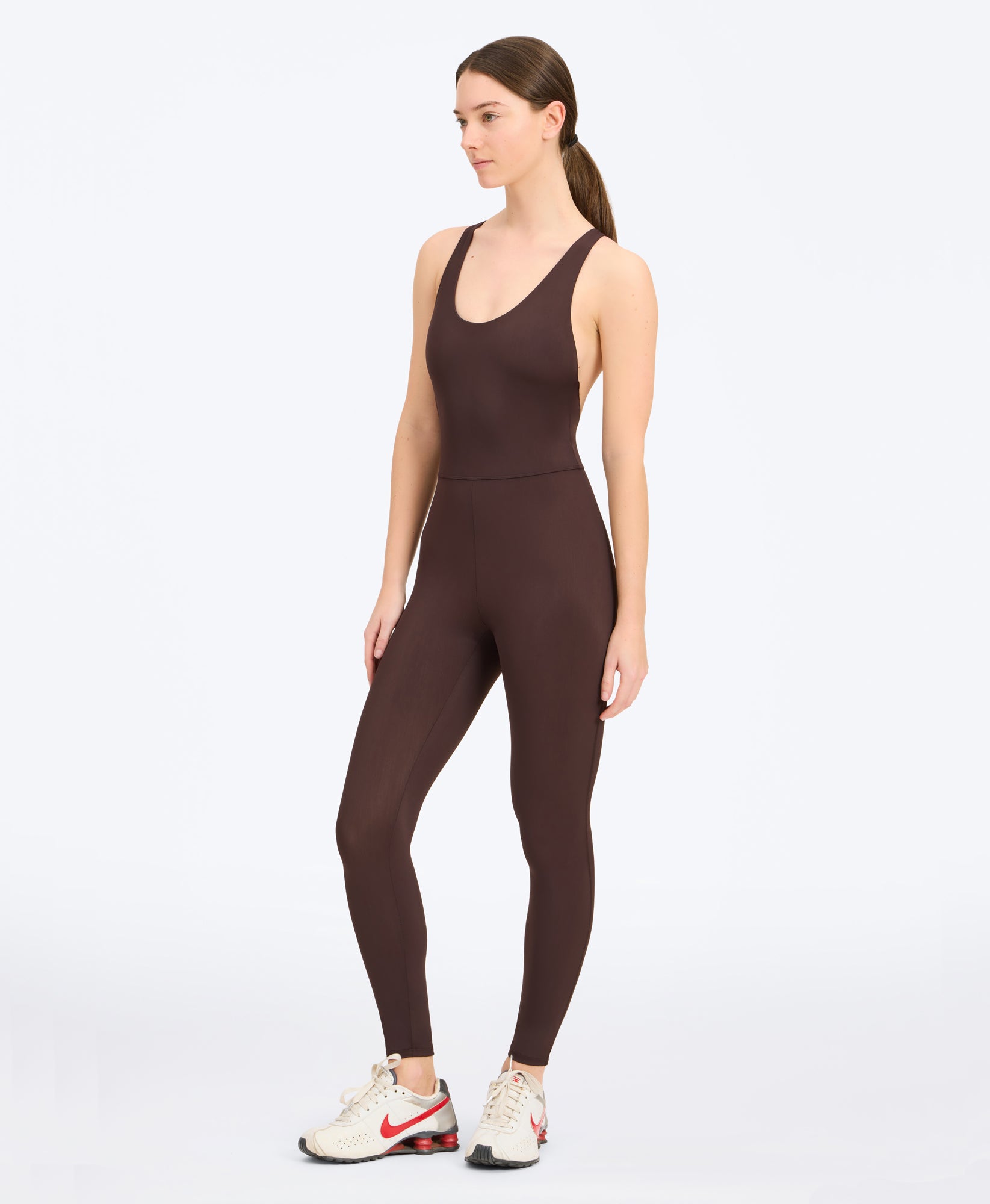 Wear One's At Liberty Unitard in clove on studio model side view