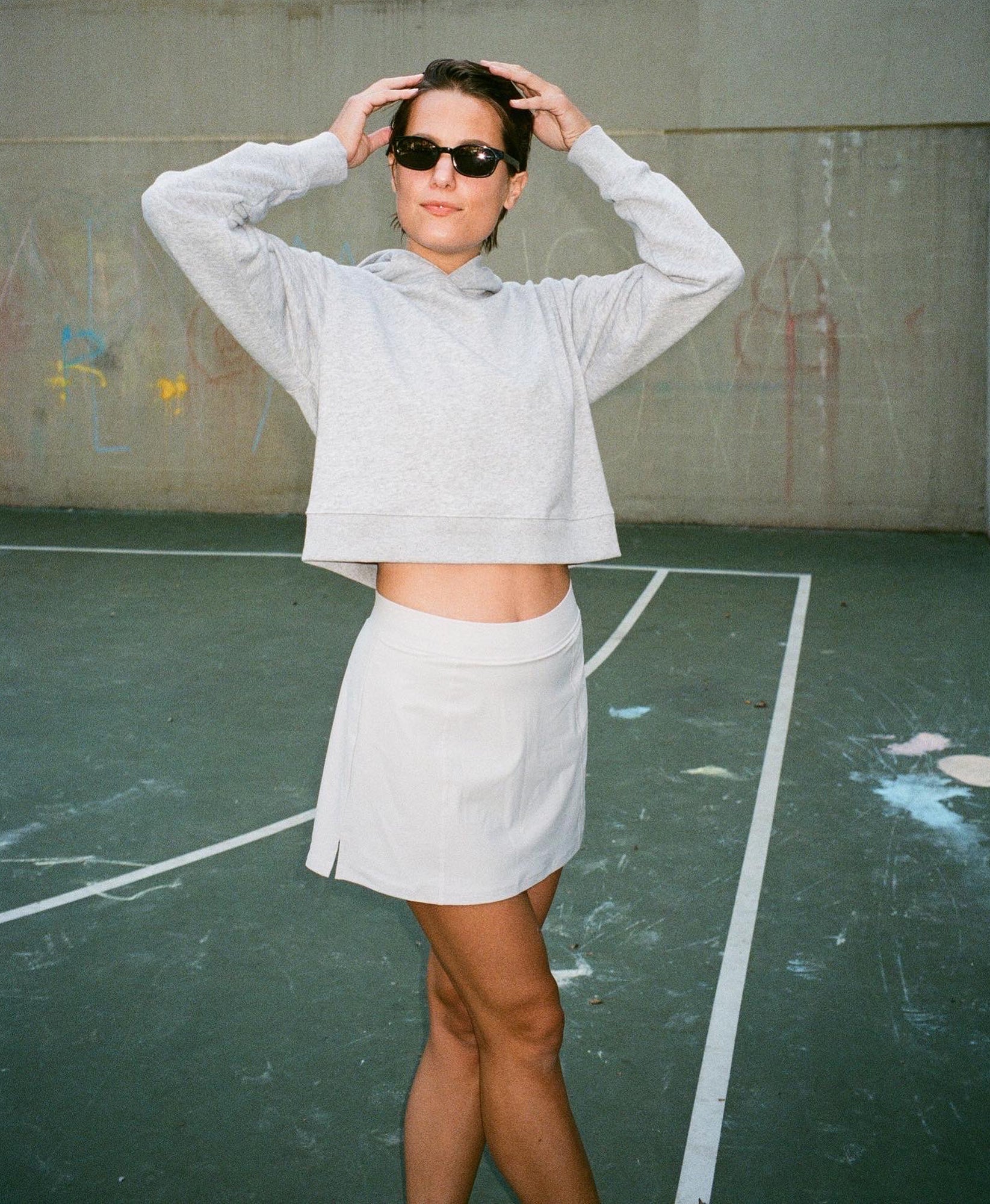 Wear One's At Simple Skort in Cloud on model wearing sunglasses on basketball court