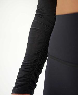 Wear One's At The Scrunch Shrug in Goji Black on model detailed sleeve view
