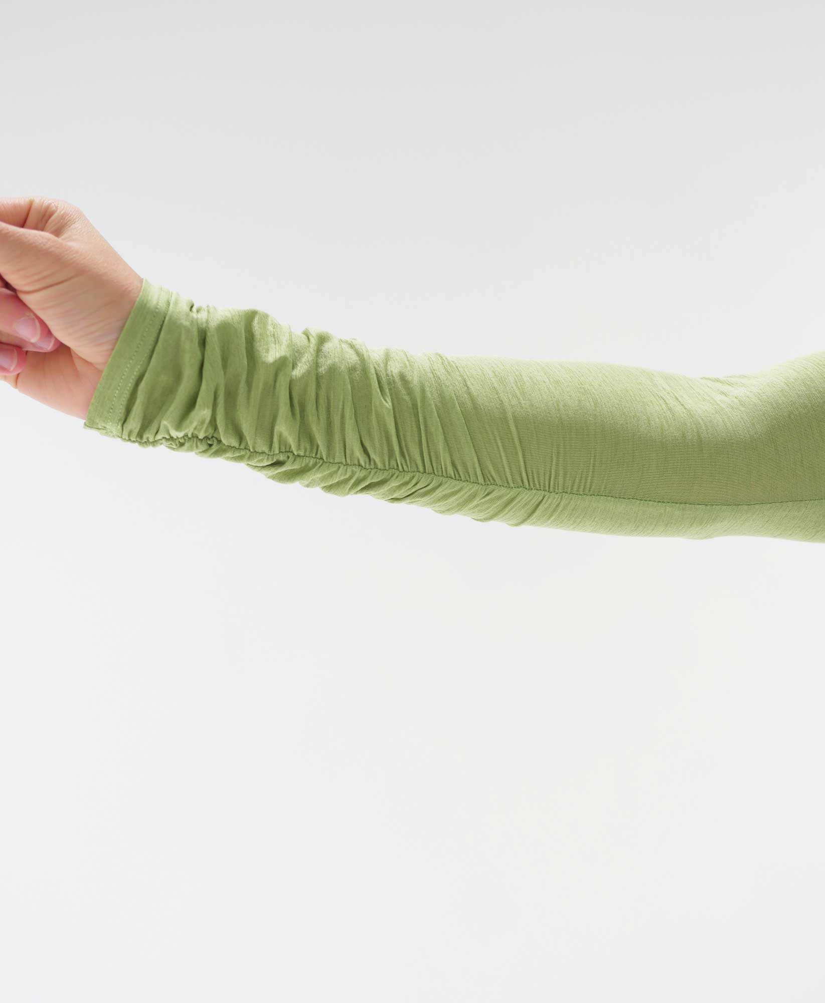 Wear One's At The Scrunch Shrug in Kiwi Green on model detailed sleeve view