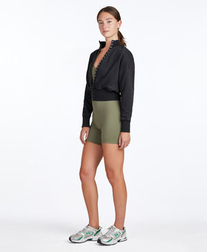 Wear One's At Varsity Bike Short Unitard in Prairie Green on model wearing Snapfront Jacket full side view