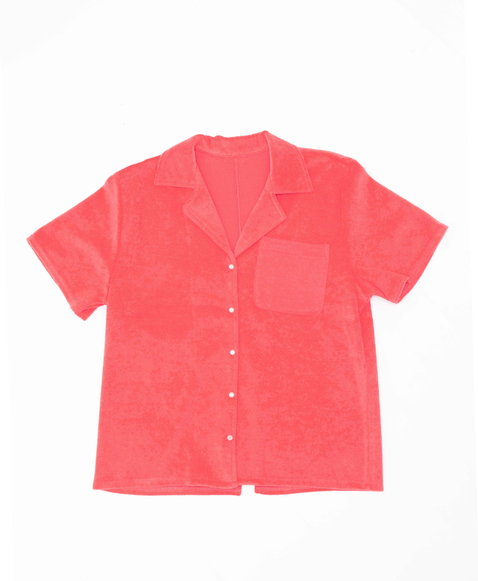 Wear One's At Aqualina Terry Button Down in Aperol Pink on Model Standing on a Surfboard Front View