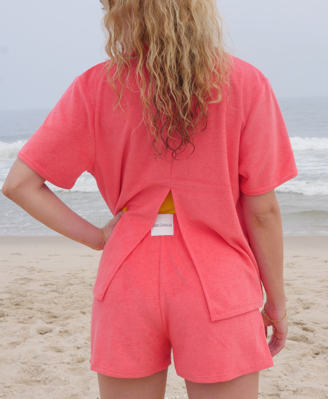 Wear One's At Aqualina Terry Cloth Shorts in Aperol Pink on Model Back Detail View