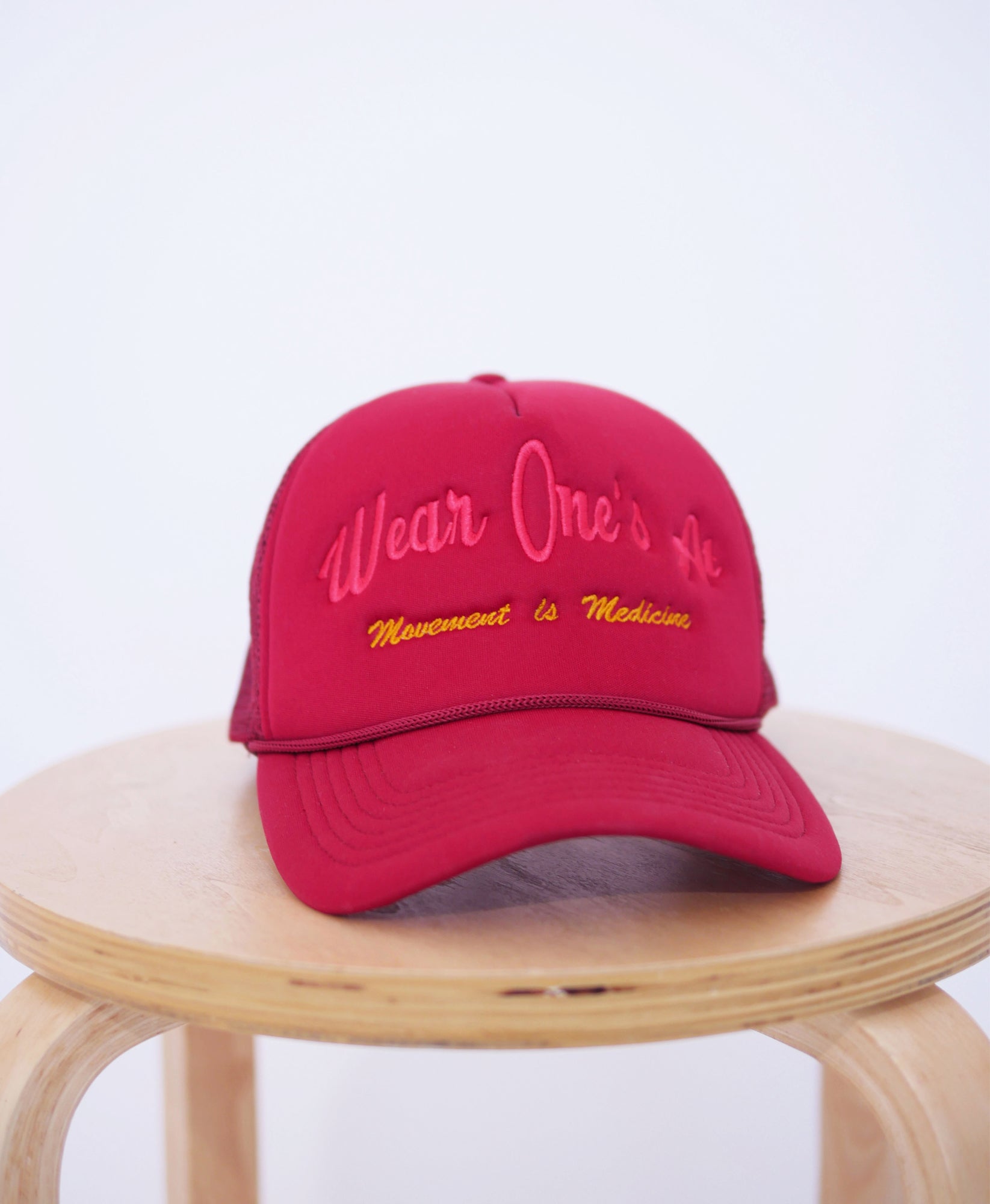 Wear One's At Logo Trucker Hat in Mars Red Front View