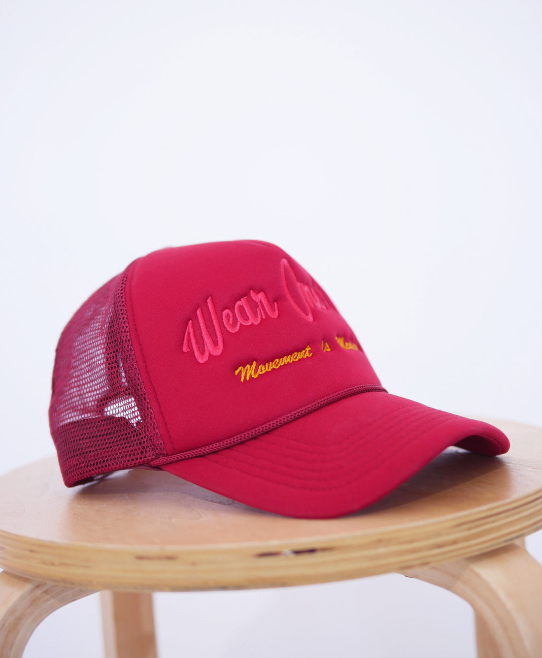 Wear One's At Logo Trucker Hat in Mars Red Side View