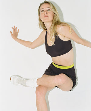 Wear One's At Race You Back Bra in Au Natural on Model Stretching Front View