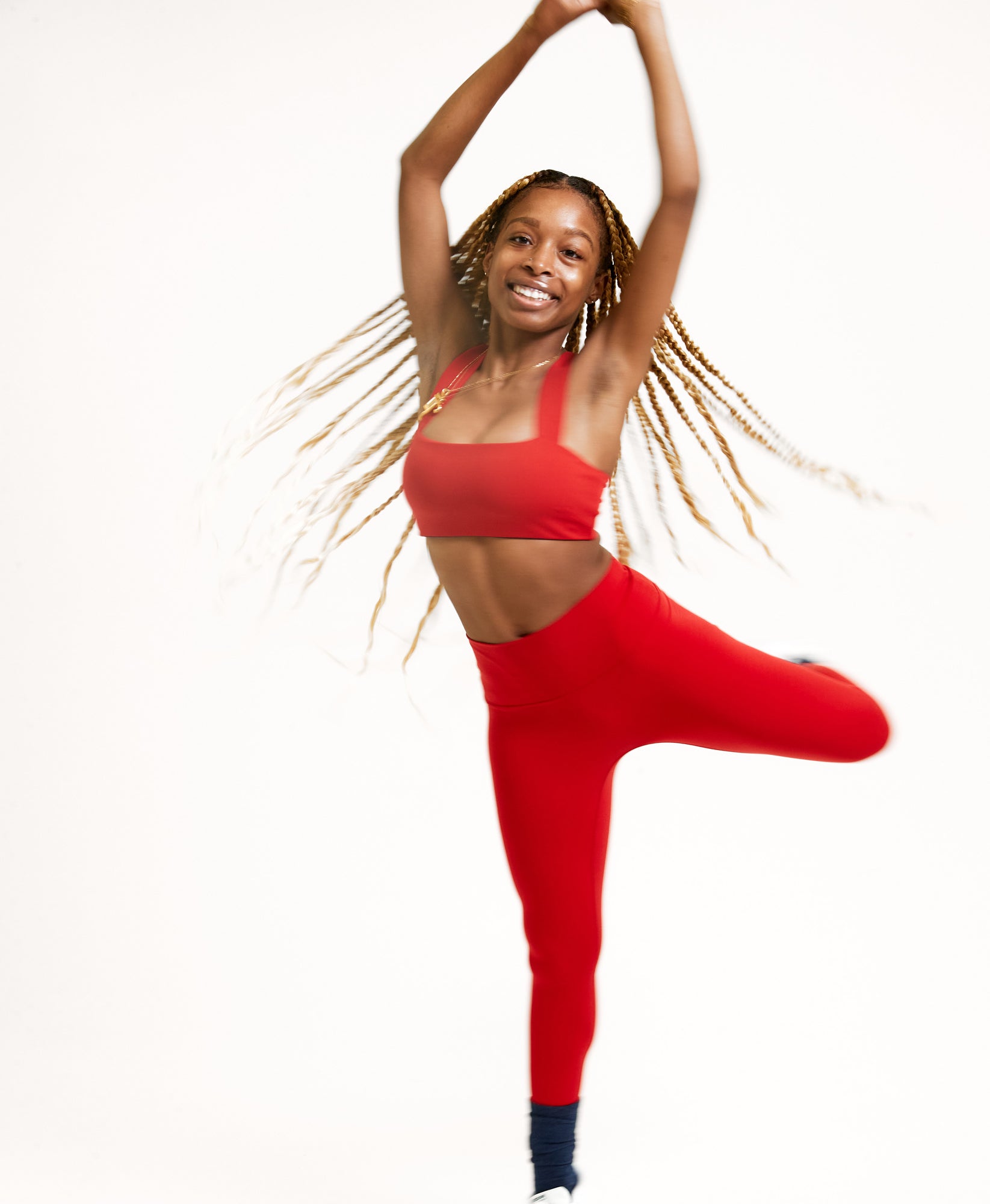 Wear One's At Routine Legging in Casanova Red on Model with Leg Up Stretching