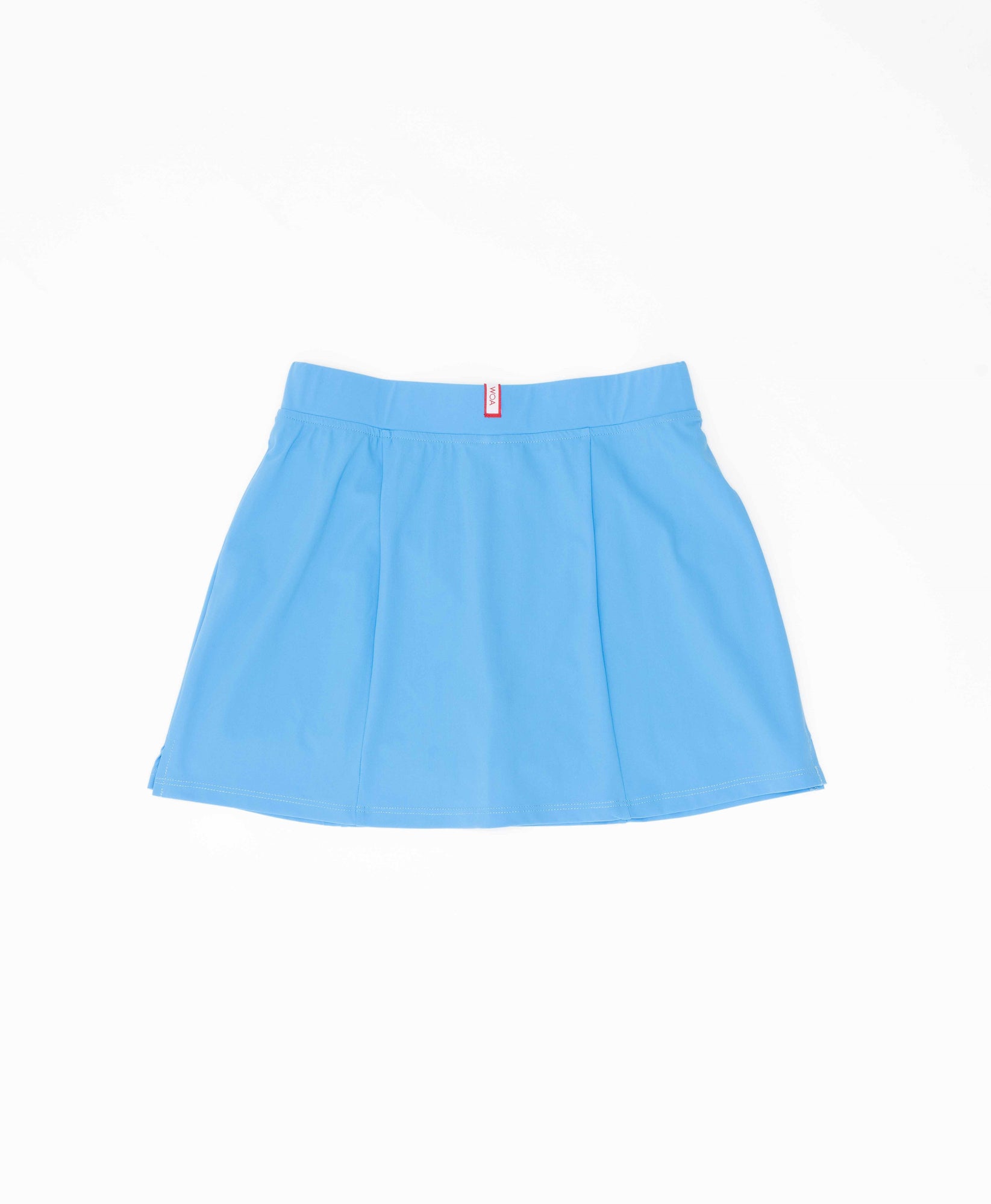 Wear One's At Simple Skort in Forget Me Not Blue on Model Leaning Against the Wall Front View
